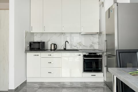 The fully equipped kitchenette includes everything you need for a home-cooked meal.