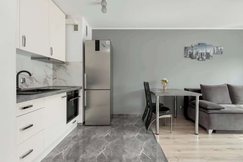 Enjoy your favorite shows on the flat-screen television in the elegant living area.