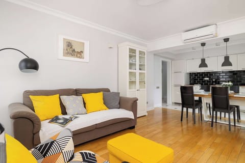 Relax in the stylish living room with a comfortable sofa and modern decor.