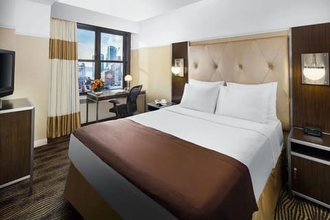 Wake up to skyline views from crisp, cloud-soft bedding.