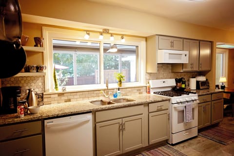 Kitchen w/dishwasher and gas range.