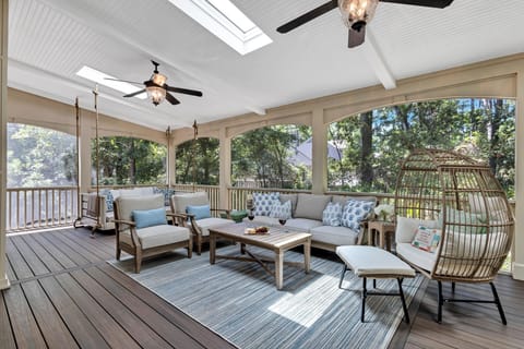 Experience a unique blend of comfort and style on our spacious porch. Perfect for lounging or enjoying conversations with loved ones.