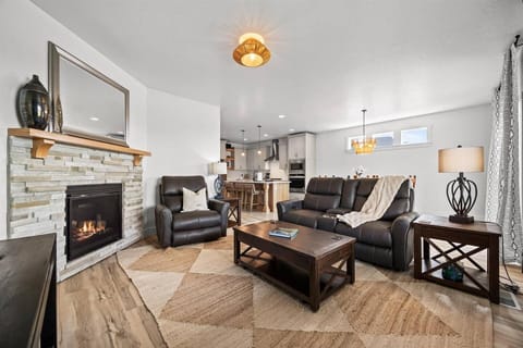 Open concept living at Glenrock - enjoy the ambiance of a fire in the fireplace and get cozy in reclining chairs