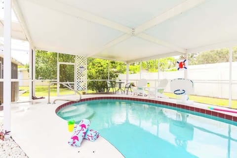 Soak up the sun or cool off in your own screened-in pool, fully fenced for privacy and perfect for families or groups to enjoy throughout the day.
