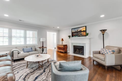 Living Room: Bright space with plush seating and a stylish fireplace for perfect relaxation!