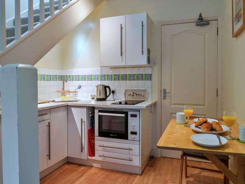 Kitchen, Kitchen Appliance, Furniture, Major Appliance, Countertop, Flooring, Interior Design, Wood, Cabinetry, Floor