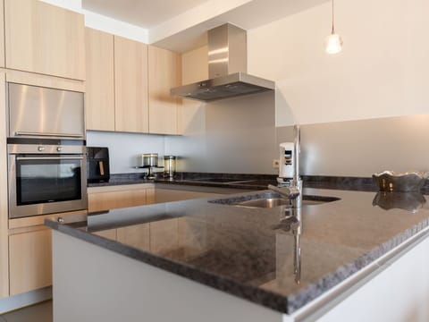 Kitchen, Countertop, Kitchen Appliance, Interior Design, Flooring, Cabinetry, Major Appliance, Kitchen Stove, Stove, Home Appliance