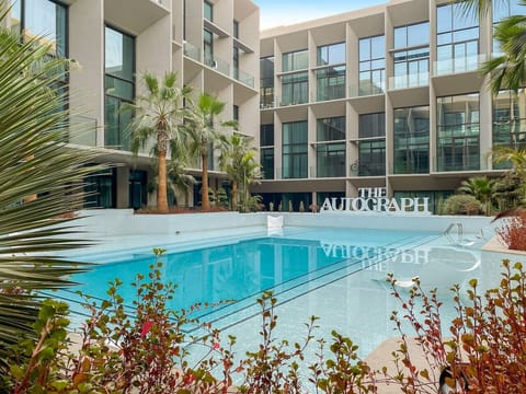 Pool Paradise: Dive into luxury with our stunning pool surrounded by lush greenery!