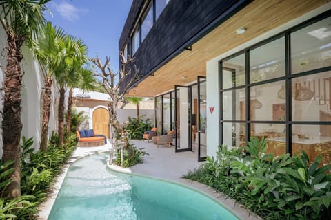 Private garden with plunge pool, double lounger and relaxing table & chairs  