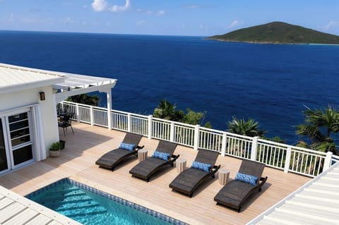 Pool deck area with a view of Hans Lollik Island directly across from the villa.