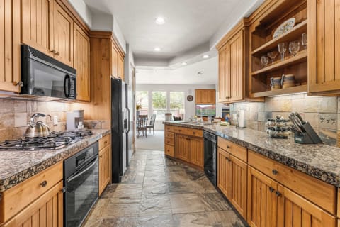 The elegant kitchen offers ample space & every home comfort​