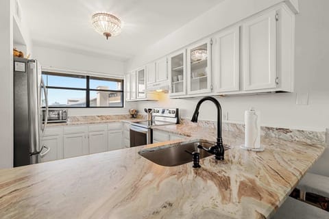 Granite kitchen countertop and a view towards the Ole River