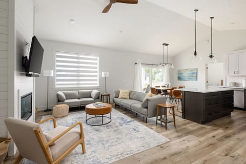 A warm, homey view from the living room to the kitchen and dining space