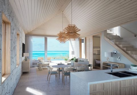 Gather for cocktails as the sea shimmers beyond.