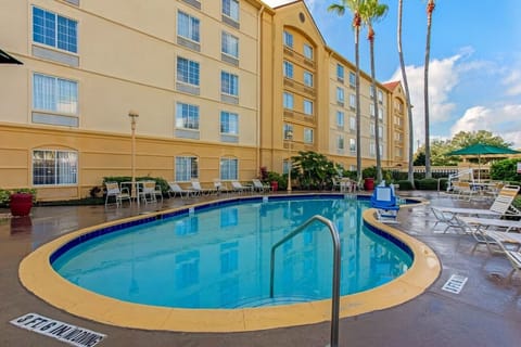 Dive into sunny afternoons by the sparkling outdoor pool.