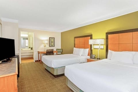 Settle in with roomy beds, a desk, and easy vanity access.