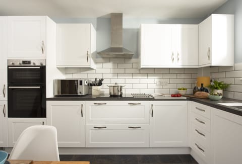 Puffin Way, Lelant. Ground floor: Kitchen with an electric oven, induction hob, television, microwave, dishwasher, filter coffee machine, fridge/freezer.