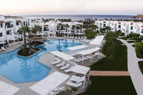 Soak in sweeping pool views with the sea beyond.