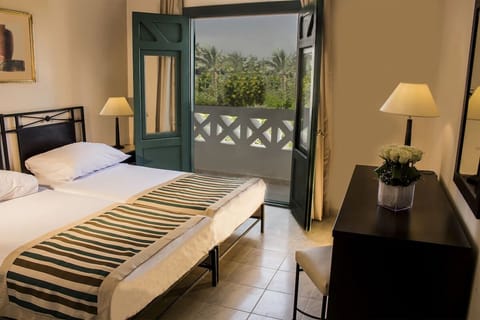 Step onto the balcony and soak in palm-lined serenity.
