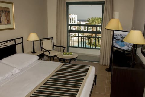 Sip morning coffee beside the window with resort views.