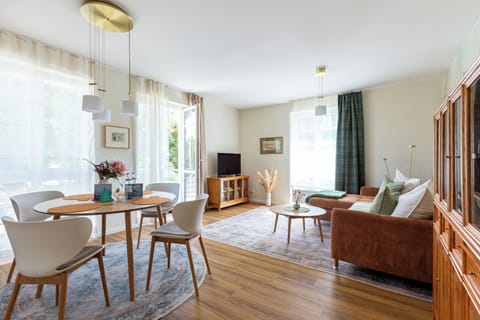 Bright Living Area with Dining Table and Sofa