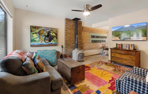 Welcome home to this colorful, comfortable retreat located downtown but also within a block of trails.