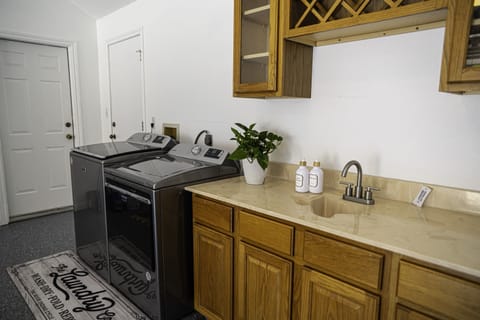 The laundry room in the lakehouse is a practical and functional space designed to make the chore of laundry as efficient and convenient as possible. 