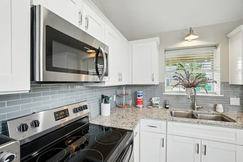 Fully Stocked Kitchen with Stove, Microwave, Refrigerator and Dishwasher