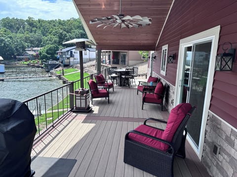 Very nice newer large deck with end table firepit table uncovered. Gas Grill