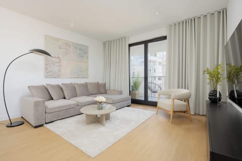 Living room with a comfortable sofa and TV. 