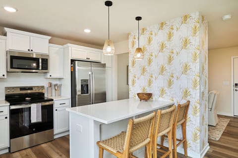 Kitchen with dining room behind