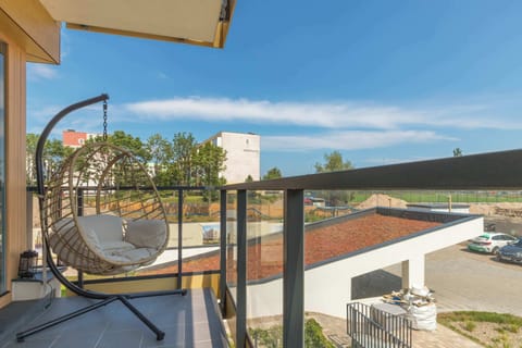 Furnished balcony with a nice view of the surrounding area.