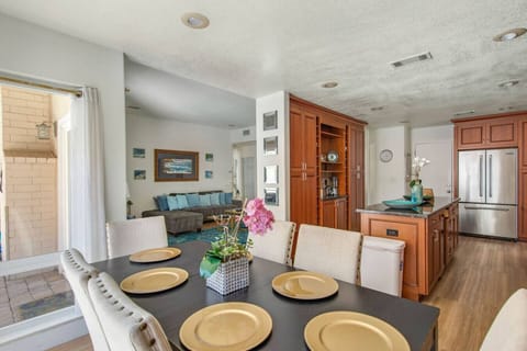 Bright and spacious open floor plan connecting the kitchen, dining, and living spaces for easy gathering.