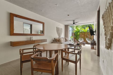 Chic living room with smart TV & terrace—ideal for unwinding in Tulum.