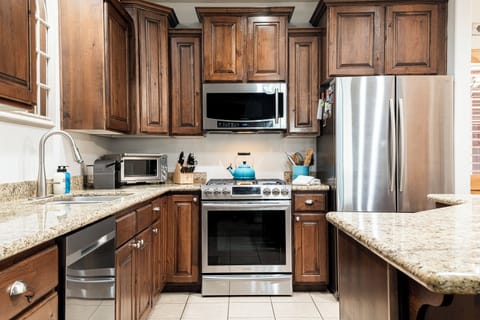 Fully equipped kitchen with stainless steel appliances