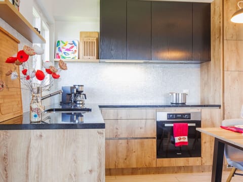 Furniture, Kitchen, Cabinetry, Countertop, Kitchen Appliance, Interior Design, Wood, Flooring, Major Appliance, Cupboard