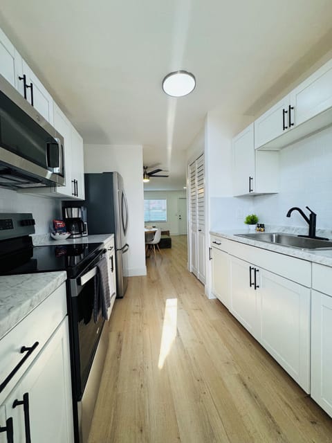 Fully equipped kitchen with quality appliances and sleek finishes.