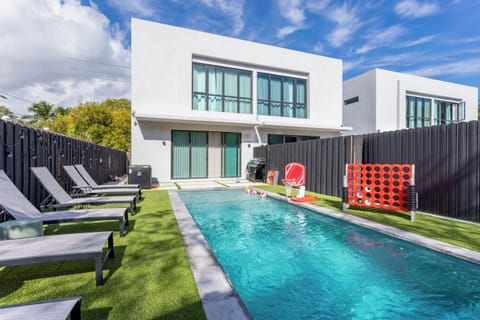 Modern home exterior with a luxurious swimming pool.

