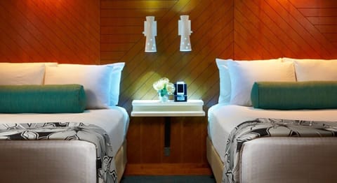 Drift off between plush pillows and warm, modern headboards.