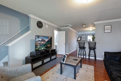 Living Room space with coffee table, pull-out sofa and TV for entertainment