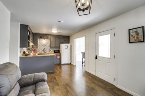 Front door, kitchen, and view of dining room entrance.