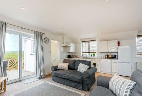 Arnold Cottage in Treyarnon Bay. Sliding doors out towards decking area