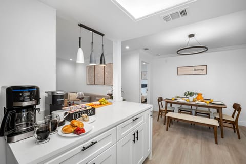 Open sightlines to the living room keep you connected while you prep meals or pour a drink.