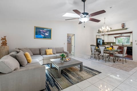 a beautifully styled and spacious living room that seamlessly blends comfort, warmth, and modern design.