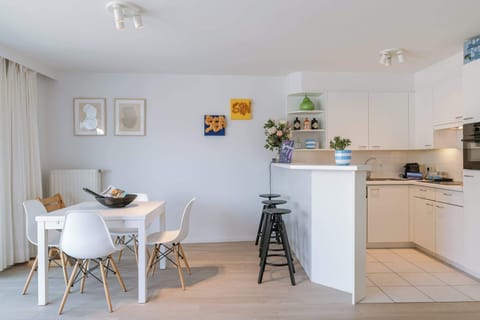 Dining Area Next to Open Kitchen

