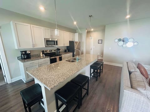 Kitchen with island and additional bar seating