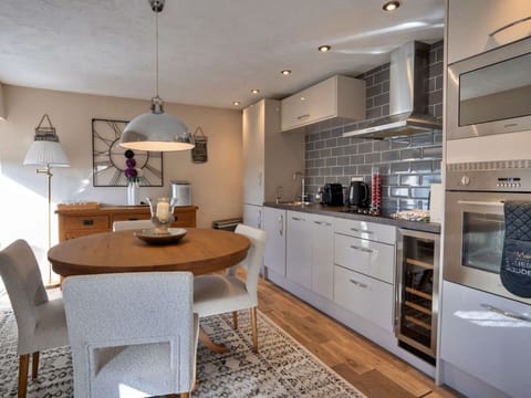 Furniture, Interior Design, Flooring, Cabinetry, Floor, Countertop, Light Fixture, Chair, Kitchen, Wood