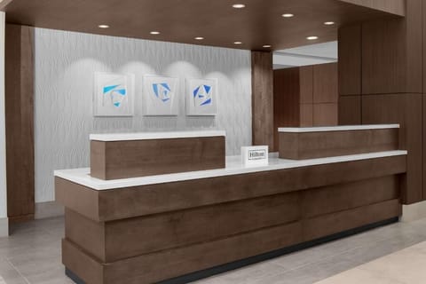 Check in smoothly at a modern, welcoming front desk.