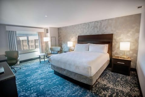 Sink into plush bedding and relax by the bright window.