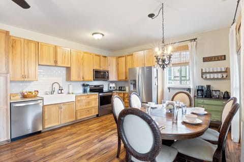 Open concept main floor includes the kitchen, dining area, and coffee station. 